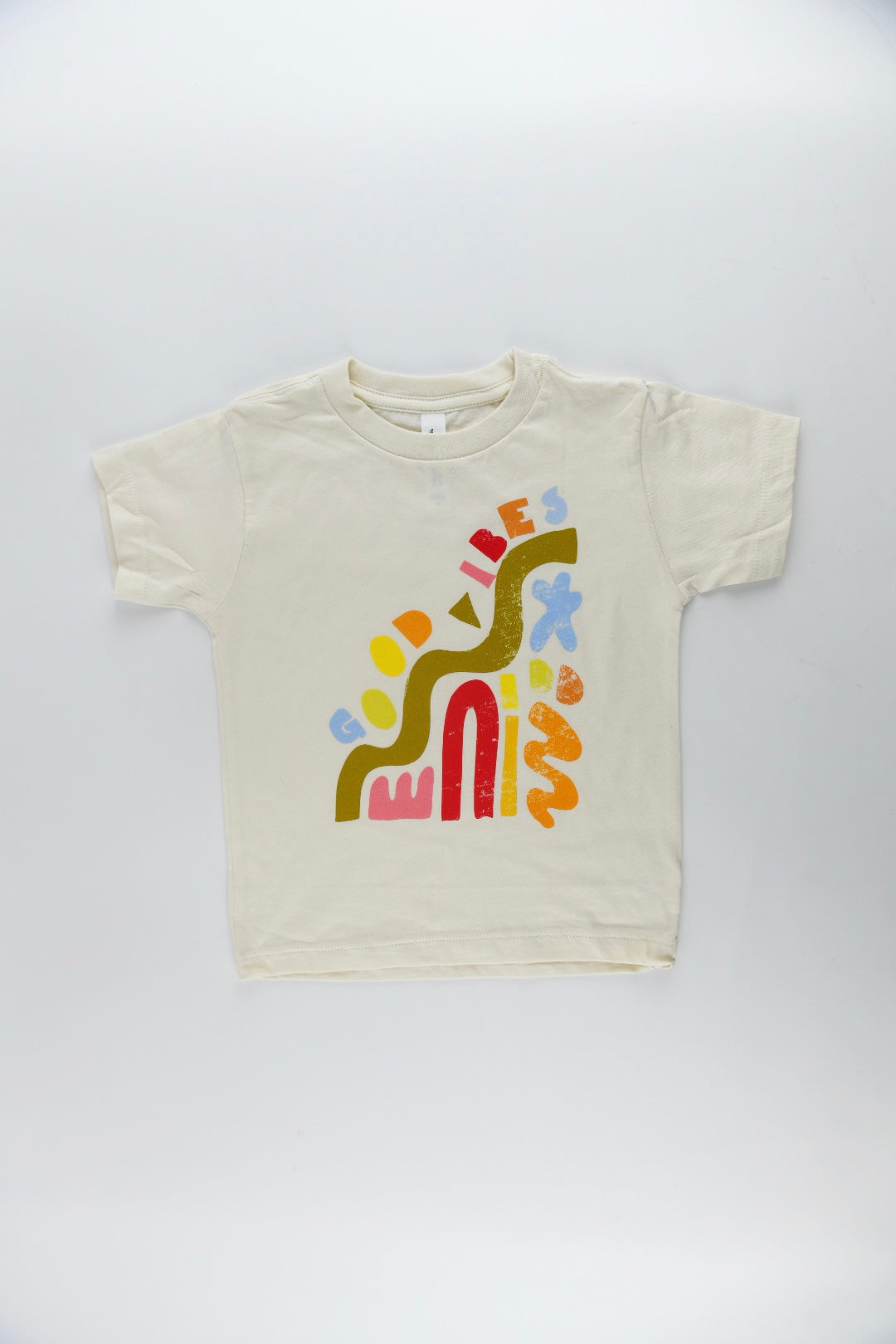 Good Vibes kids graphic tee with colorful abstract shapes