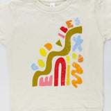 Good Vibes kids graphic tee with colorful abstract shapes
